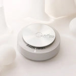 PLABEAU PLAMEDI AIR MINI high-velocity air purifier on a smooth surface, designed for compact space sanitization.